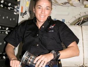 This unique photograph shows astronaut Heide Stefanyshyn-Piper activating growth of Salmonella bacteria for our spaceflight experiment on orbit during Space Shuttle Atlantis mission STS-115. This photograph illustrates the challenging and unique conditions during a spaceflight experiment that are rarely seen by most researchers. Image courtesy of National Aeronautics and Space Administration (NASA).fot. NASA