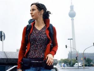 Berlin, Germany --- Young Woman with Backpack in City --- Image by © Ragnar Schmuck/zefa/Corbis