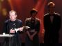 Paweł Mykietyn z nagrodą przyznaną w kategorii najlepsza muzyka za film "Essential Killing"